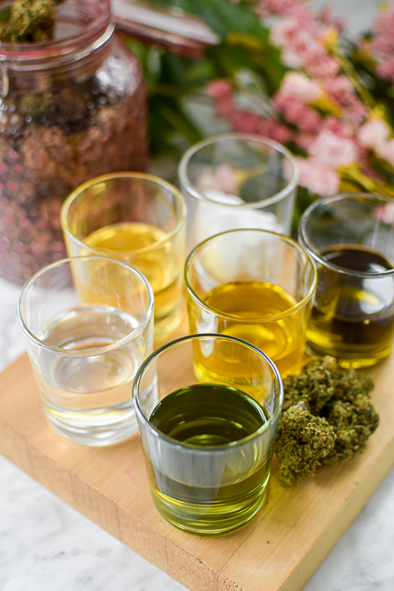 A picture of several different types o cannabis oil.
