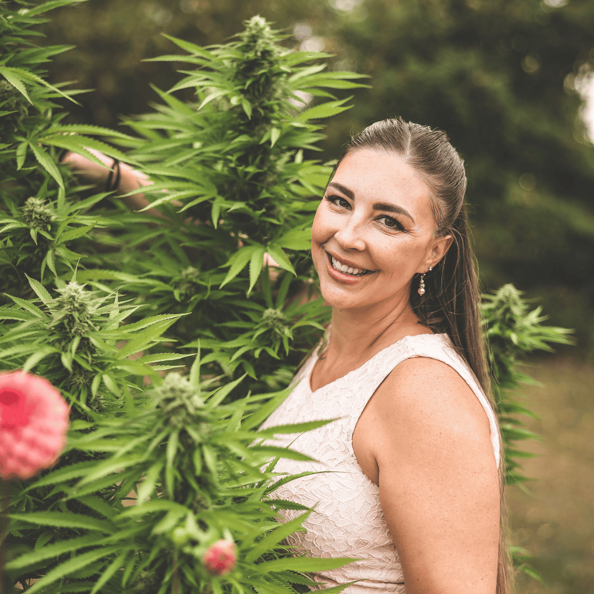 Cannabis plants with Emily Kyle outdoors, promoting medical marijuana, CBD, and cannabis education.