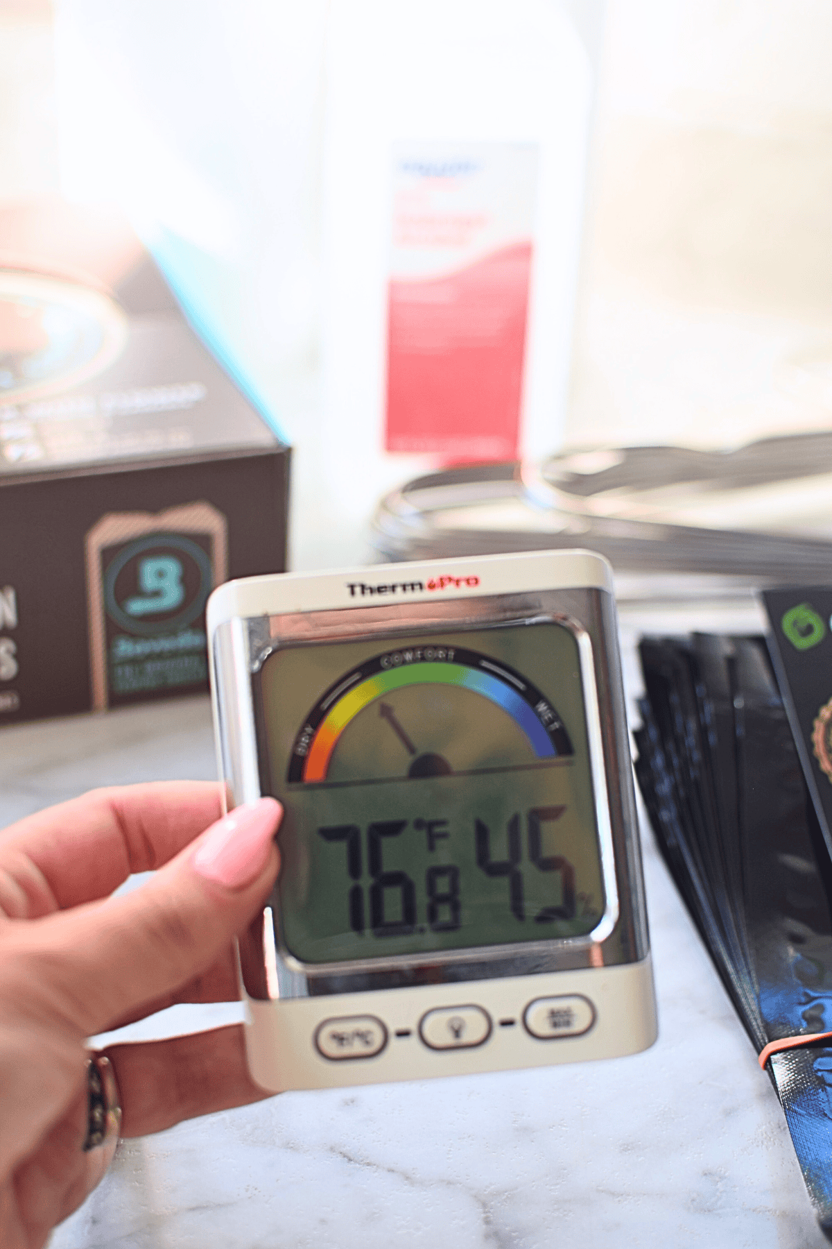 Blood sugar monitor displaying 76°F and blood glucose level of 45 mg/dL.